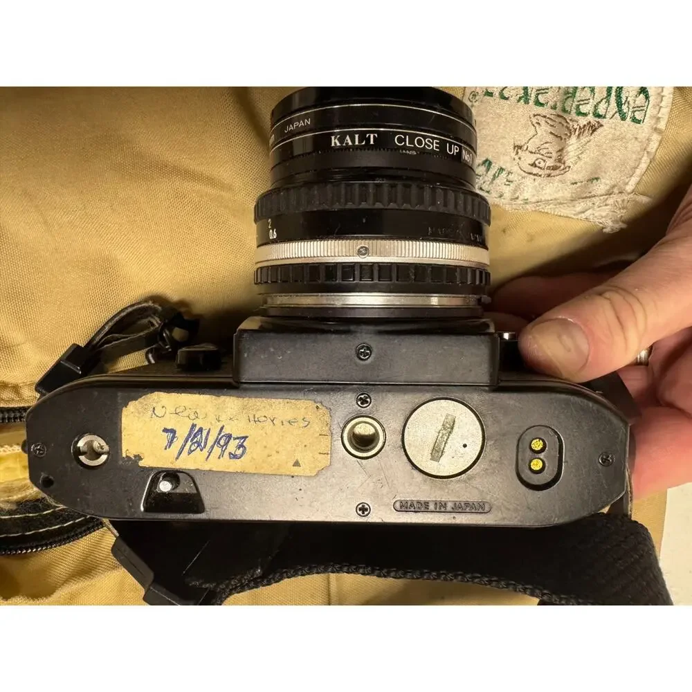 Nikon EM 35mm SLR Film Camera With 50mm Lens Plus 52mm Filter & Extra Lens & Bag